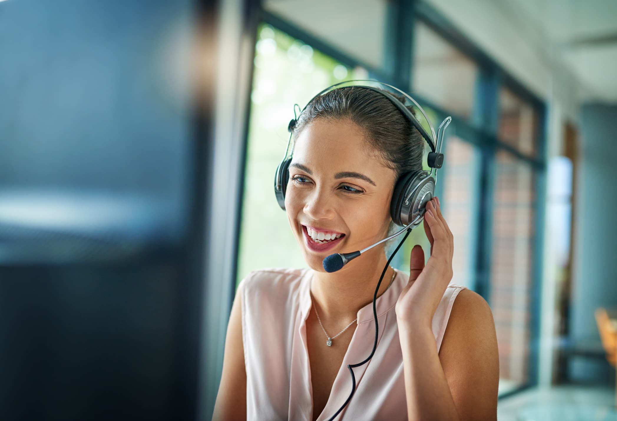 Shot of a young woman working in a call center